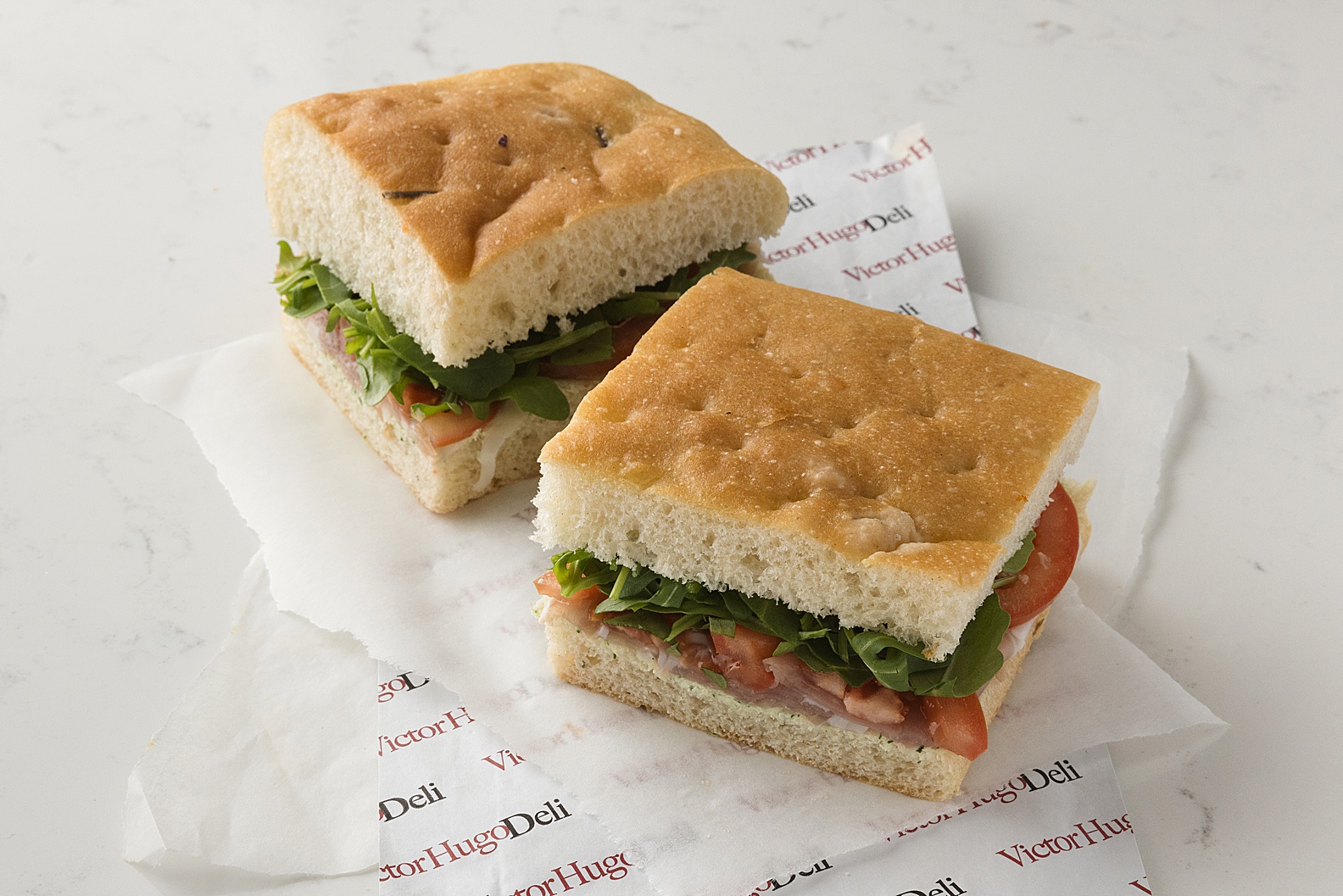Focaccia takeaway sandwich on white marble